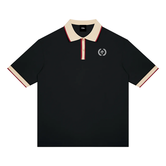 A black short-sleeve polo shirt with a cream collar and sleeve cuffs, accented by thin red stripes, featuring a small circular embroidered crest on the left chest.